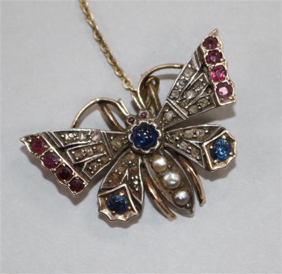 A Victorian gold, silver and gem set butterfly brooch,	 37mm.